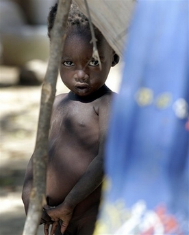 A young refugee child stares from a makeshift camp set up by villagers forced from their home in the latest cycle of ethnic violence that has spilled over from Sudan's neighboring Darfur province to eastern Chad, at Goz Beida, Wednesday, Nov. 29, 2006.

Conflicts over land and water between Arab nomads and black farmers are being fueled by governments seeking their own agendas.

Potential oil finds in Darfur is also an issue, involving China, the United States, and Western Europe.

Photo: AP/Christophe Ena