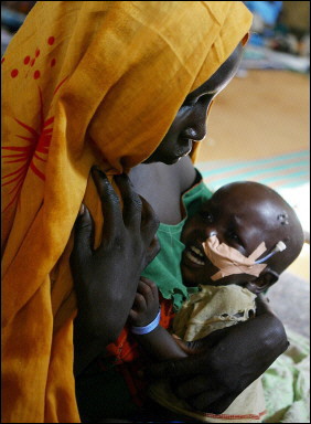 A mother tries to console her child at the Abu Shouk refugee camp near El Fasher in Darfur, Sudan, August 25, 2004

Photo: AFP/Jim Watson