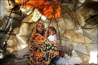 A displaced Sudanese woman sits with her daughter in their barrack at the Sakali Displaced Persons camp in Darfur city of Nyala, February 2007.

Picture: AFP/Mustafa Ozer