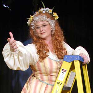 Mildred on a ladder, dressed as Juliet